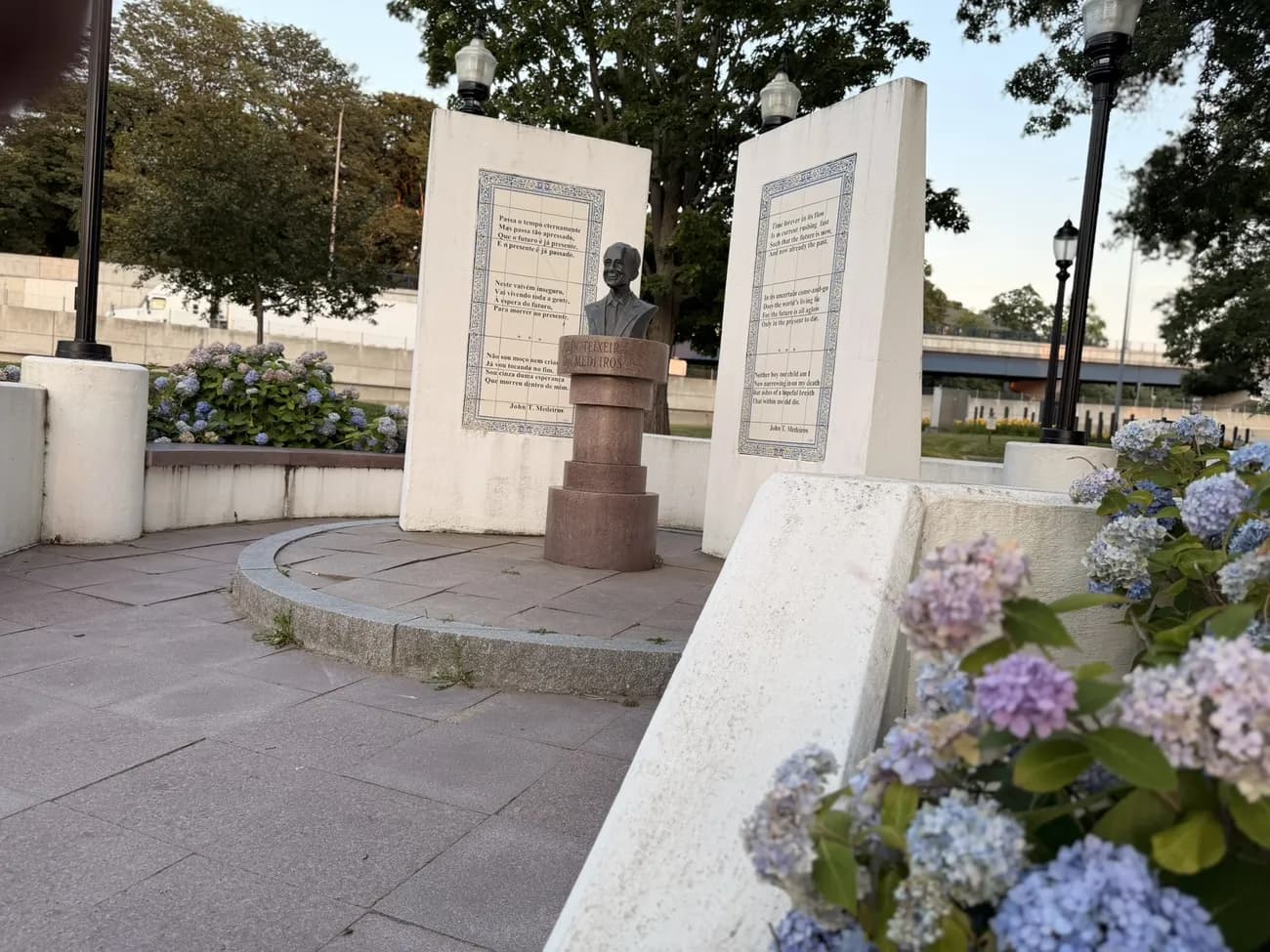 Hydrangeas in bloom around the memorial plaza and its bronze busts.
