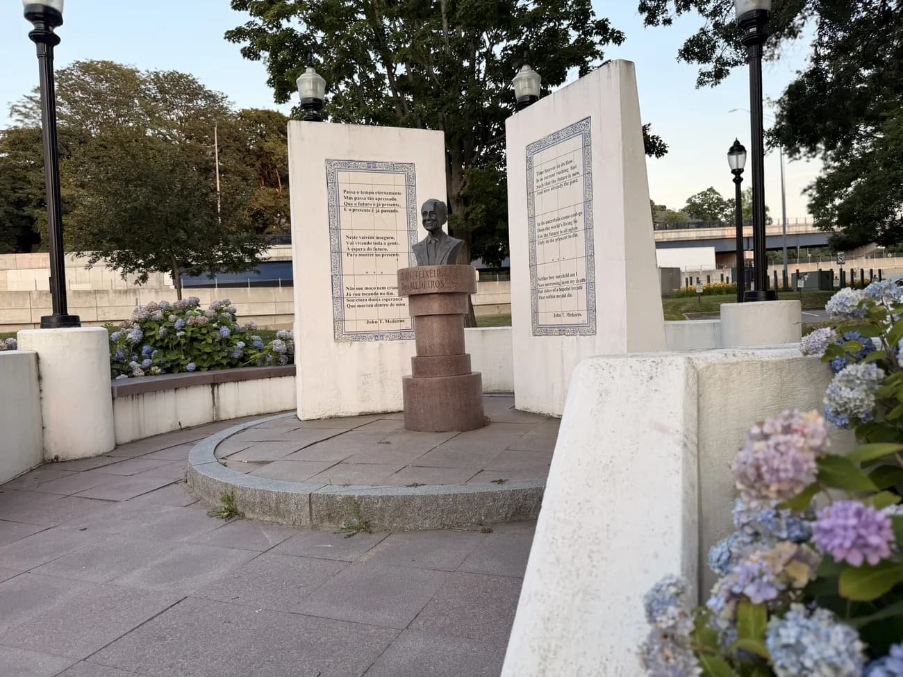 Hydrangeas in bloom around the memorial plaza and its bronze busts.