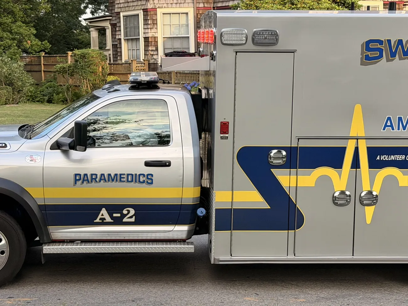 A Fall River emergency vehicle parked on a residential street.