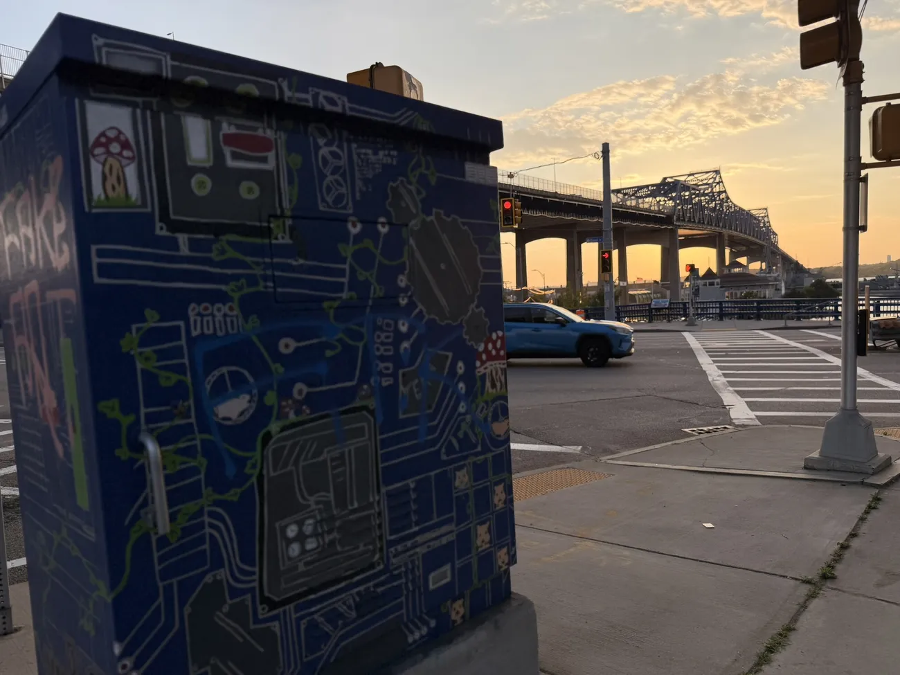 A utility box painted with circuit-board artwork — small-scale public art.