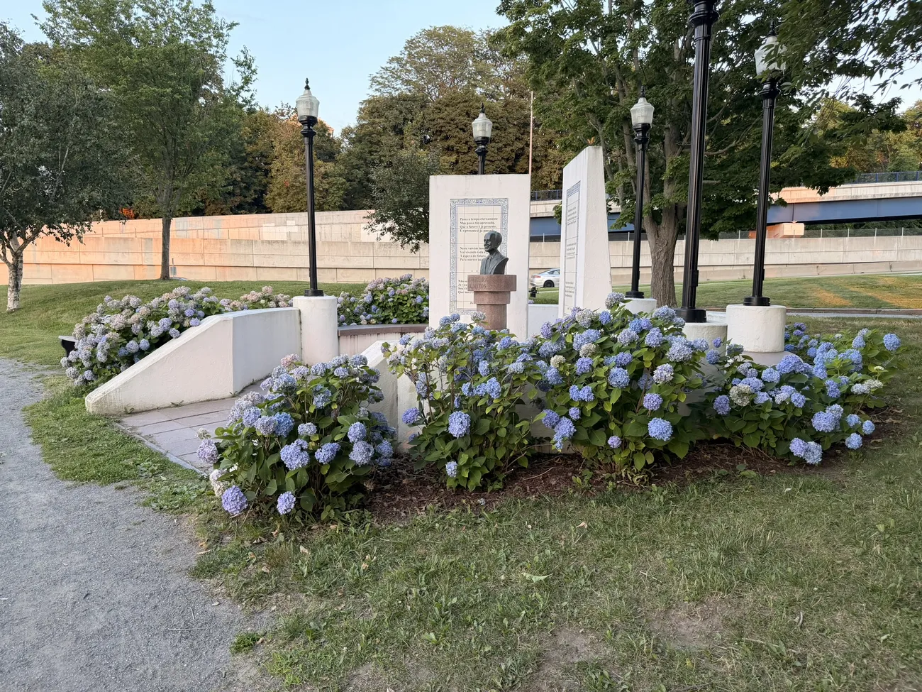 Hydrangeas in bloom around the memorial plaza and its bronze busts.