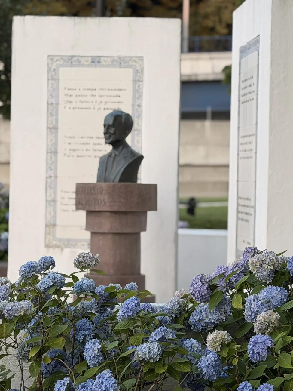 Hydrangeas in bloom around the memorial plaza and its bronze busts.